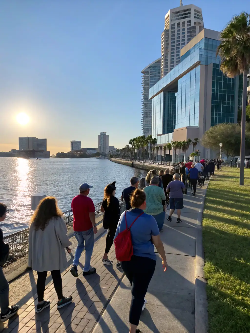 A photograph of a guided tour group exploring the historic port of Sausset-les-Pins, led by a knowledgeable member of Les Vieux Bouts de Sausset, highlighting the area's maritime significance.
